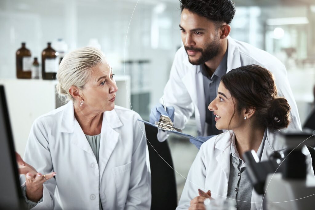 Clinical experts reviewing study data and discussing safety findings in a research setting